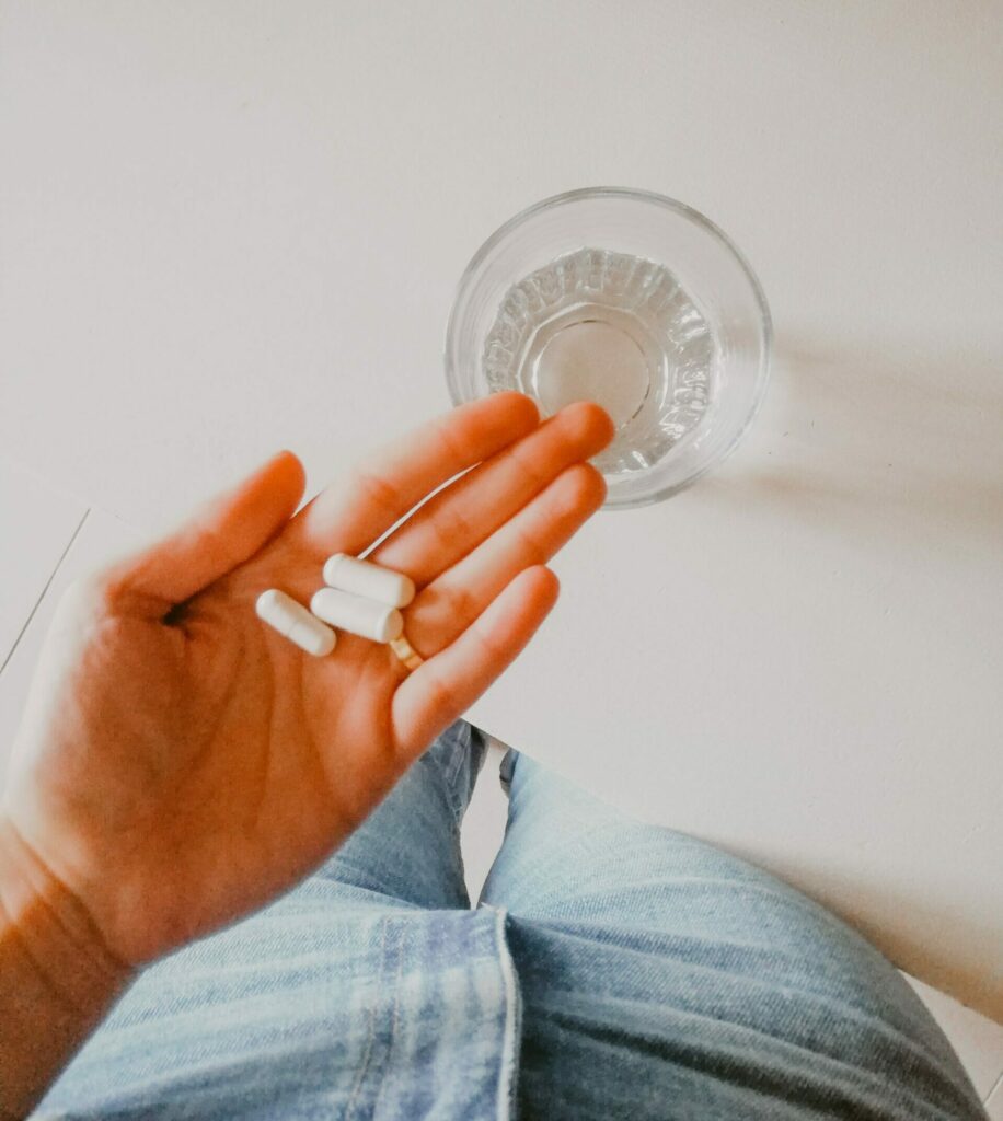 Dietary supplement pills in a woman's hand