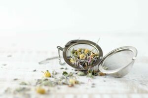 Open tea egg ball with loose herbs in it